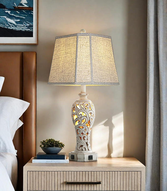 Farmhouse rustic 25-inch table lamp with carved hollow design, linen shade, dual USB charging ports, and nightlight bulb included